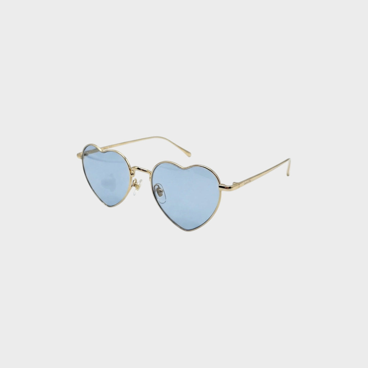 Tasoni gold frame heart-shaped sunglasses with light blue lenses.
