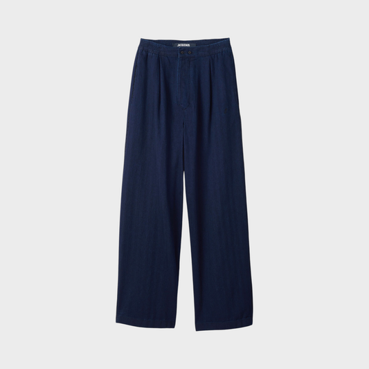 Tasoni Jacquemus Le De-Nimes dark blue fluid denim pajama jeans with a relaxed wide-leg fit and elasticated waist.