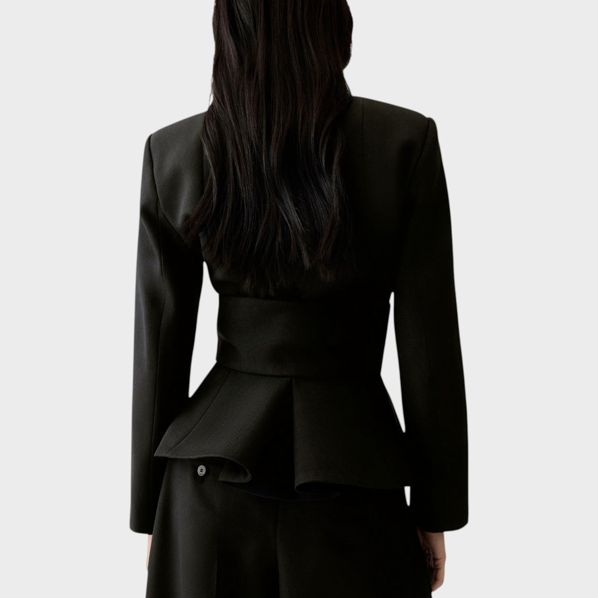 Back view of Tasoni Jacquemus La Veste Miami black fitted jacket with structured shoulders and peplum waist detail.