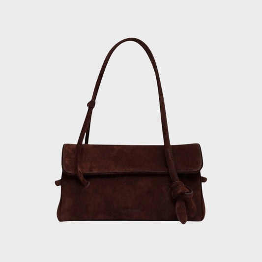 Tasoni Jacquemus Le Turismo brown suede shoulder bag with an elongated silhouette and adjustable strap.