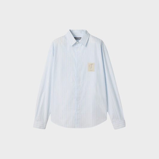 Tasoni Jacquemus La Chemise Simon blue and white striped cotton shirt with a classic collar and chest patch detail.