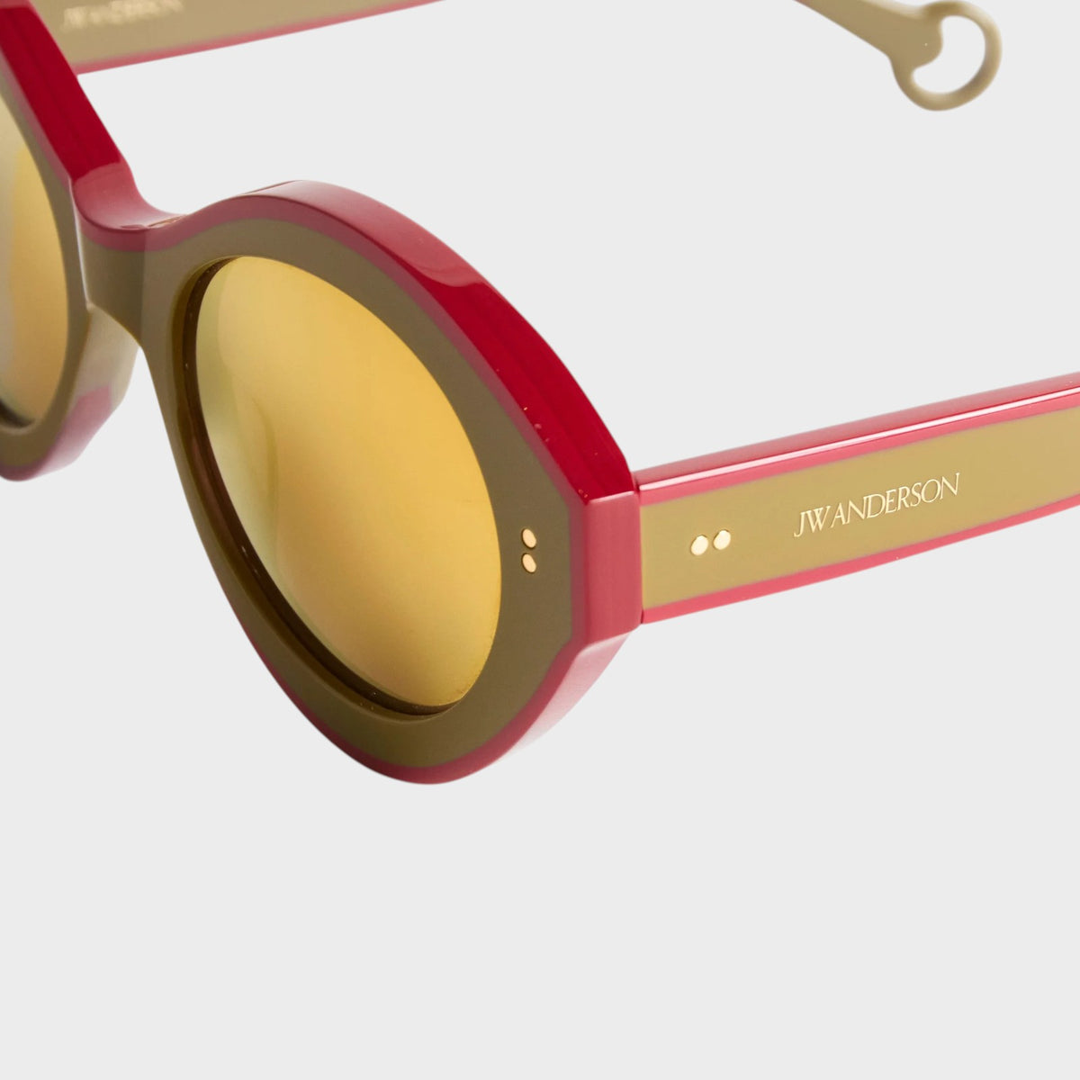 Tasoni J.W.Anderson Bumper sunglasses featuring khaki and bordeaux frames with gold mirror lenses and logo detail.