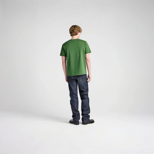 Model wearing a green JW Anderson Embroidery T-Shirt from Tasoni with dark blue jeans against a white background.