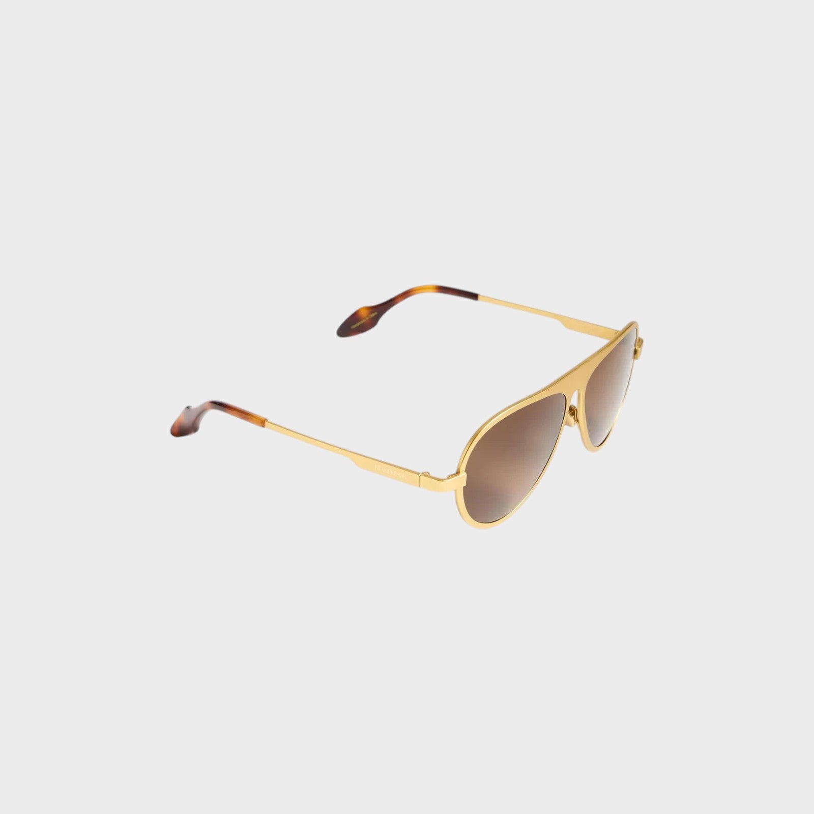 Tasoni JW Anderson Jwa05 gold titanium aviator sunglasses with brown gradient lenses and tortoiseshell temple tips.