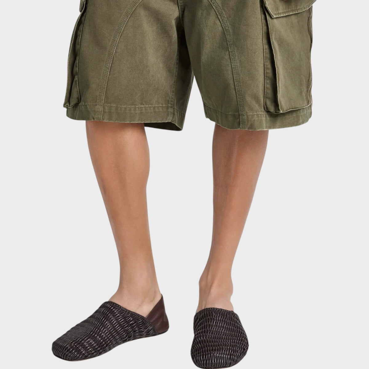 Tasoni JW Anderson dark brown woven leather slipper mules worn with olive green cargo shorts