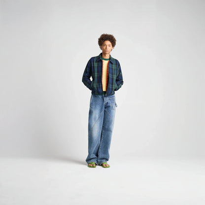 Model wearing a Tasoni J.W.Anderson navy and green cotton check print zip-up jacket with a collared neckline.