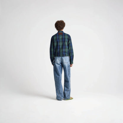 Model wearing Tasoni J.W.Anderson navy and green cotton check print collared zip jacket with blue jeans from behind.