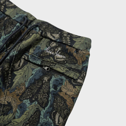 Tasoni khaki base sweatpants with an all-over floral and animal print, featuring an elastic waist and zippered pocket.