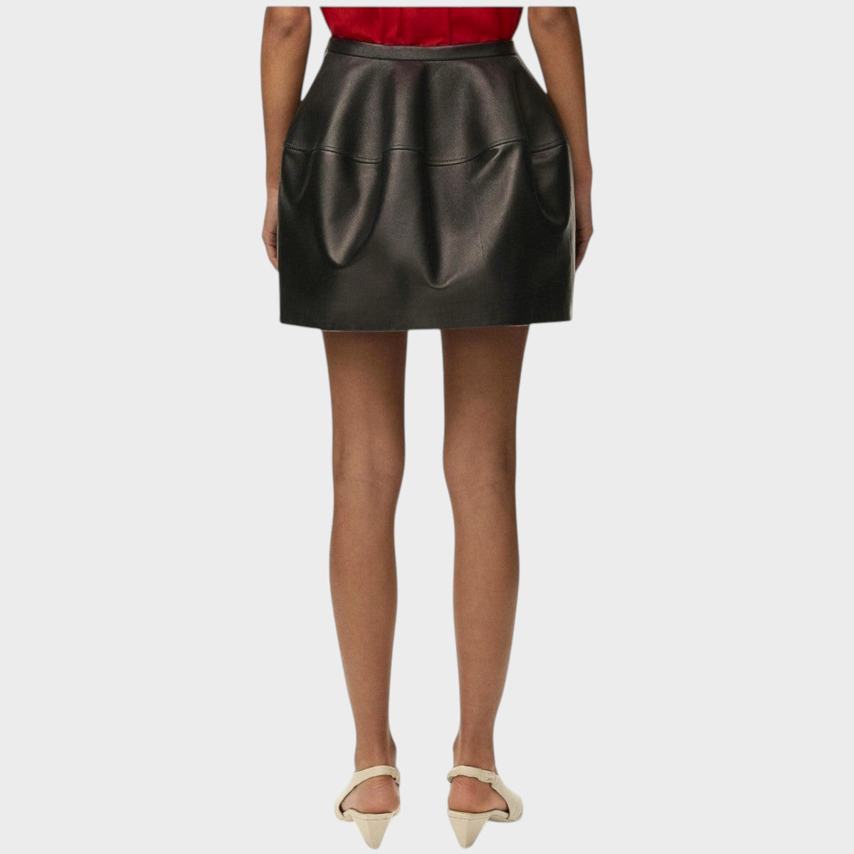 Tasoni Loewe black leather balloon mini skirt featuring a structured, voluminous silhouette, back view.