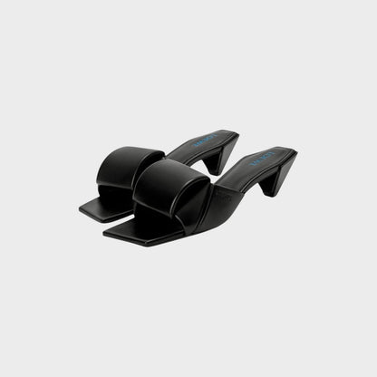 Tasoni Loewe black leather Origami slide heels with a square toe and 45mm sculptural block heel.