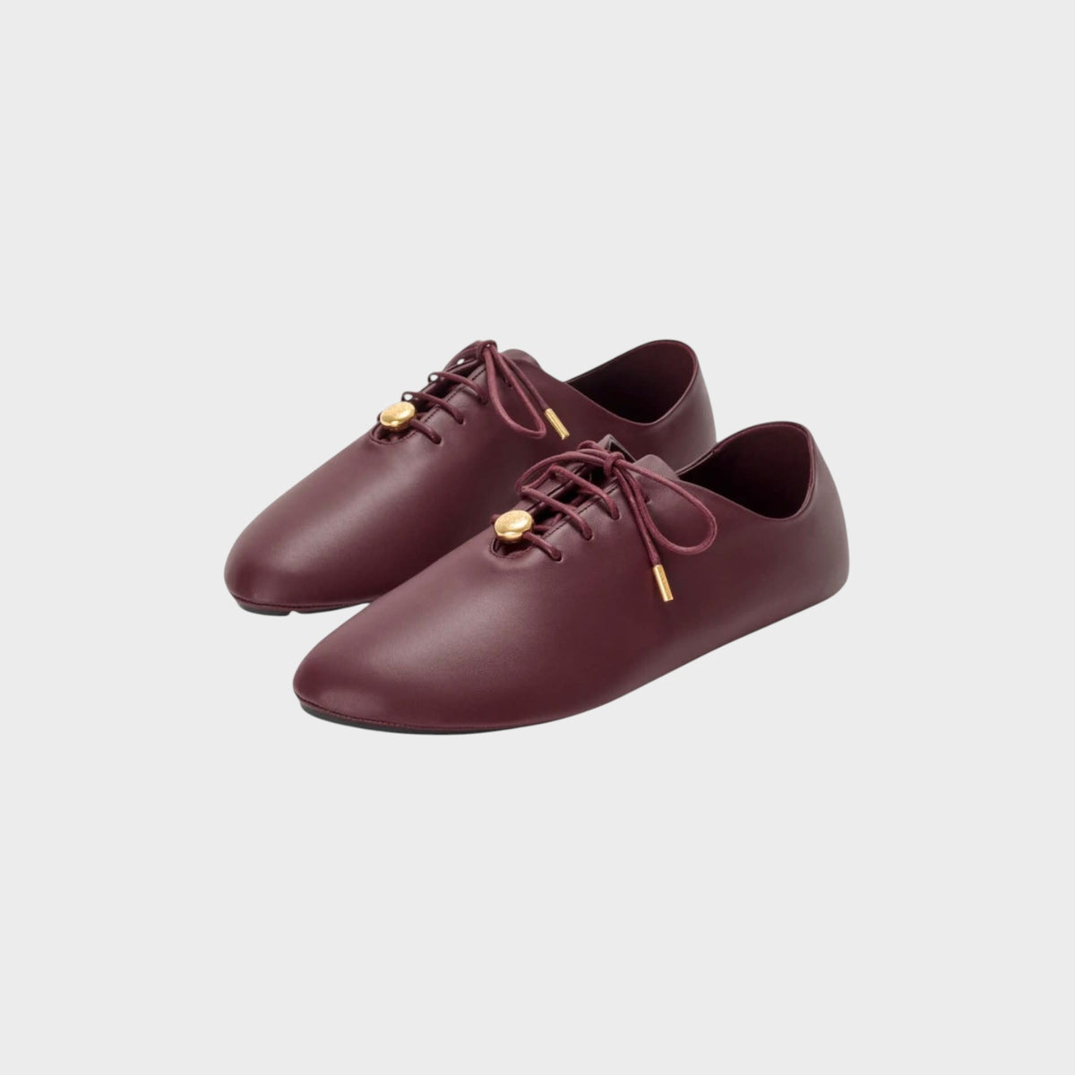 Tasoni Loewe Pebble soft burgundy leather lace-up ballerina flats with gold-tone hardware details.