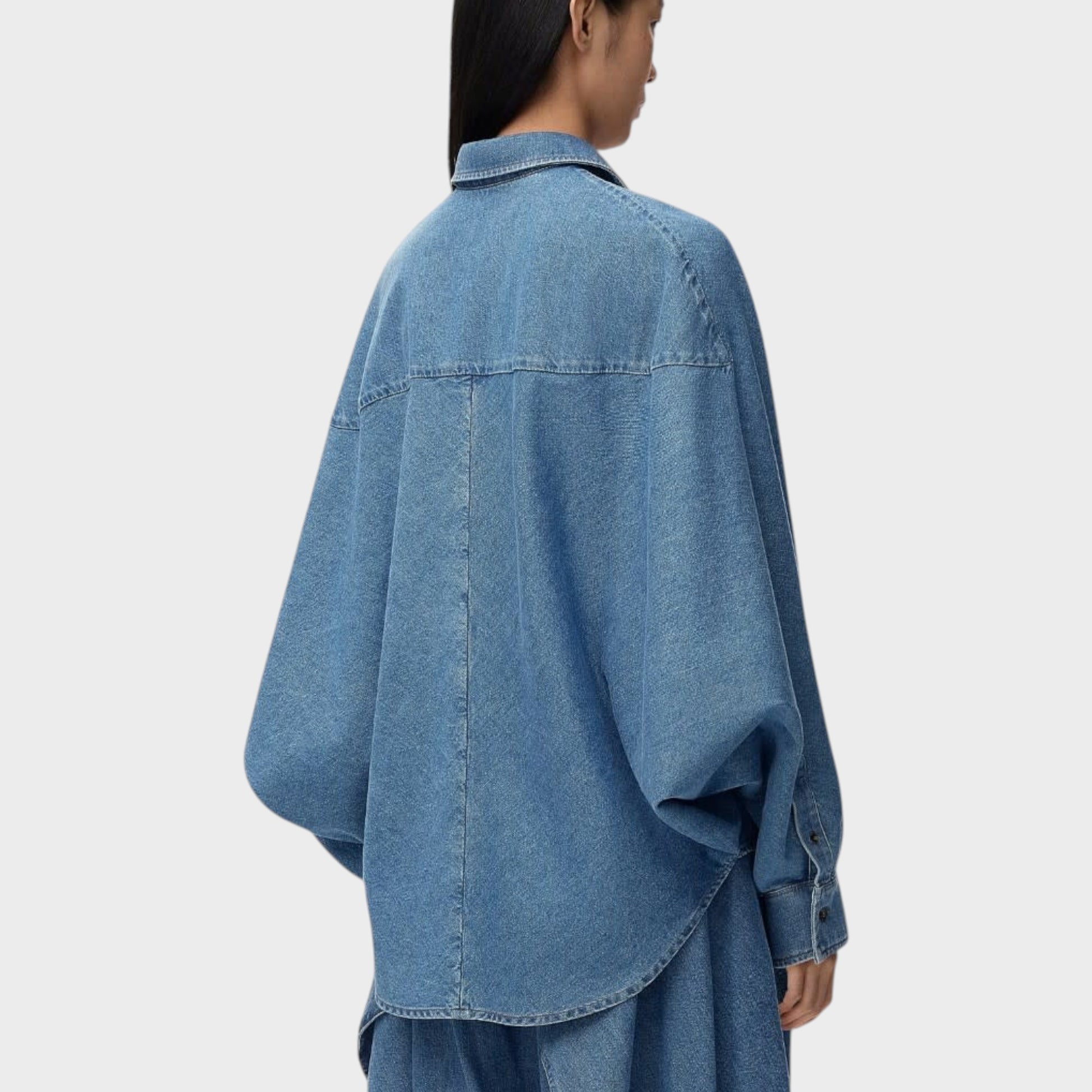 Tasoni Loewe oversized denim shirt in light blue wash, featuring a relaxed fit and dropped shoulders.