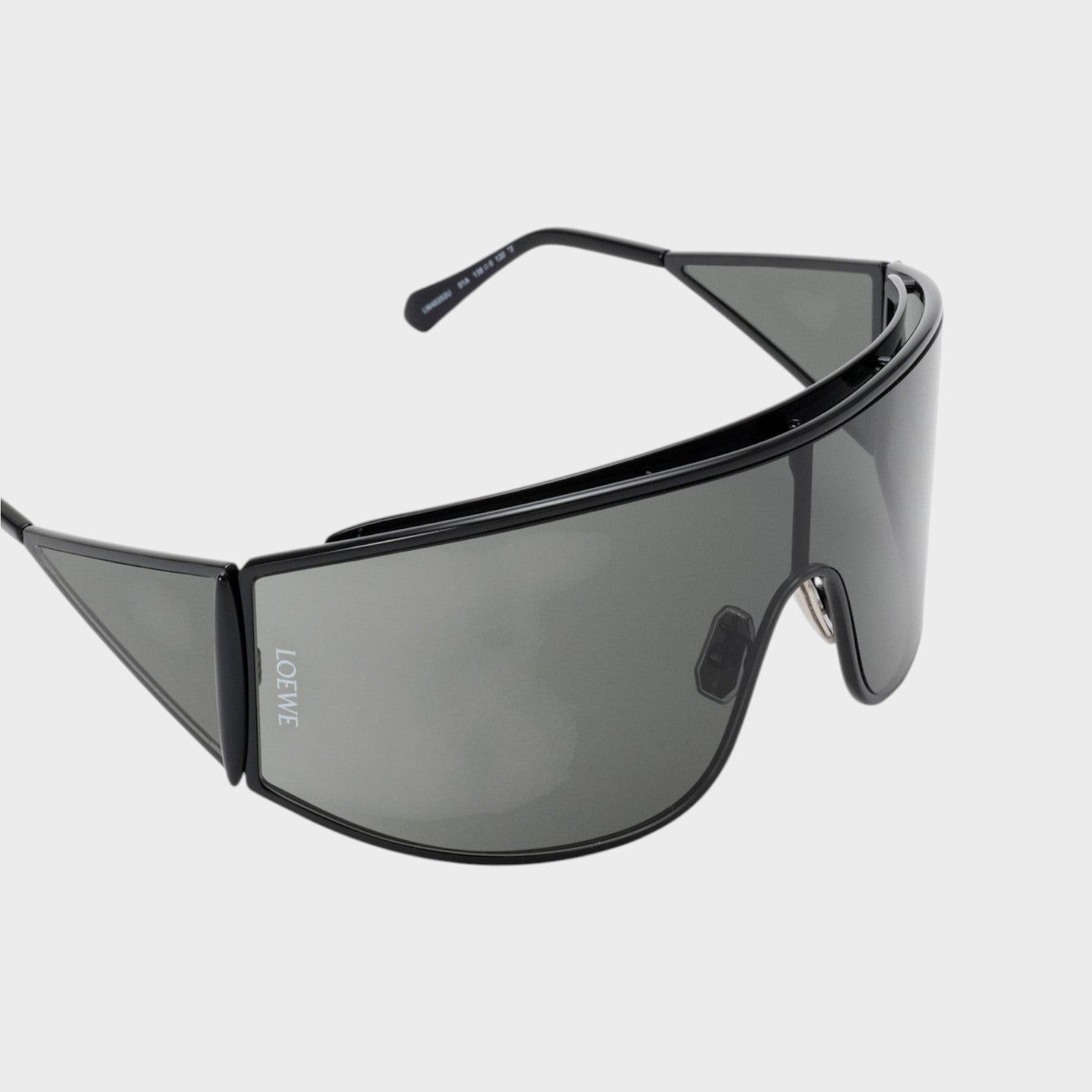 Tasoni Loewe metal shield shaped sunglasses with grey lenses and black frame.