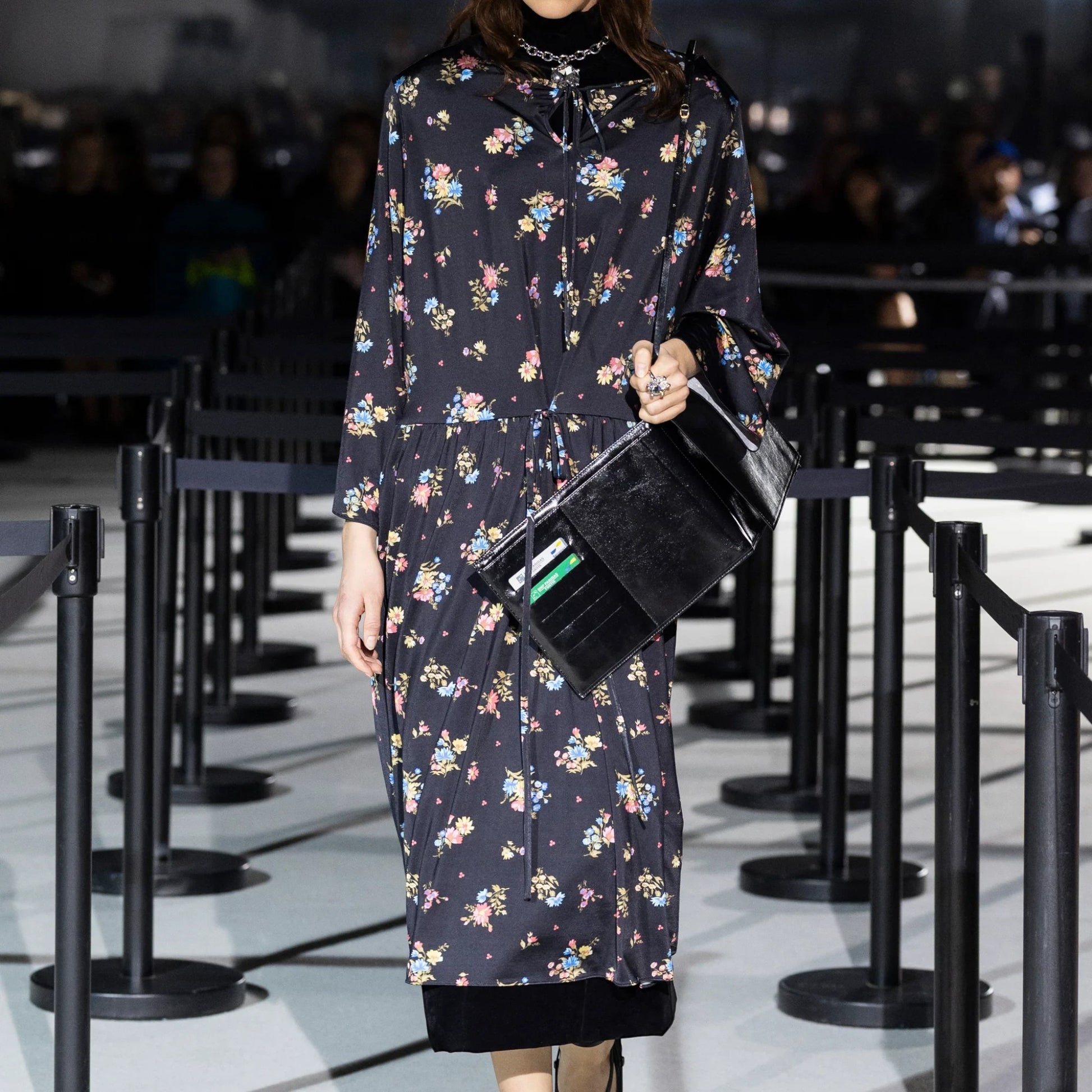 Tasoni Marie Adam-Leenaerdt black floral print long sleeve crew neck midi dress with tie waist.