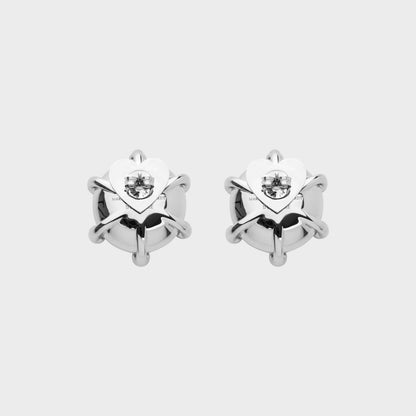 Tasoni Marie Adam-Leenaerdt brass stud earrings with pink crystal accents and heart-shaped backing.