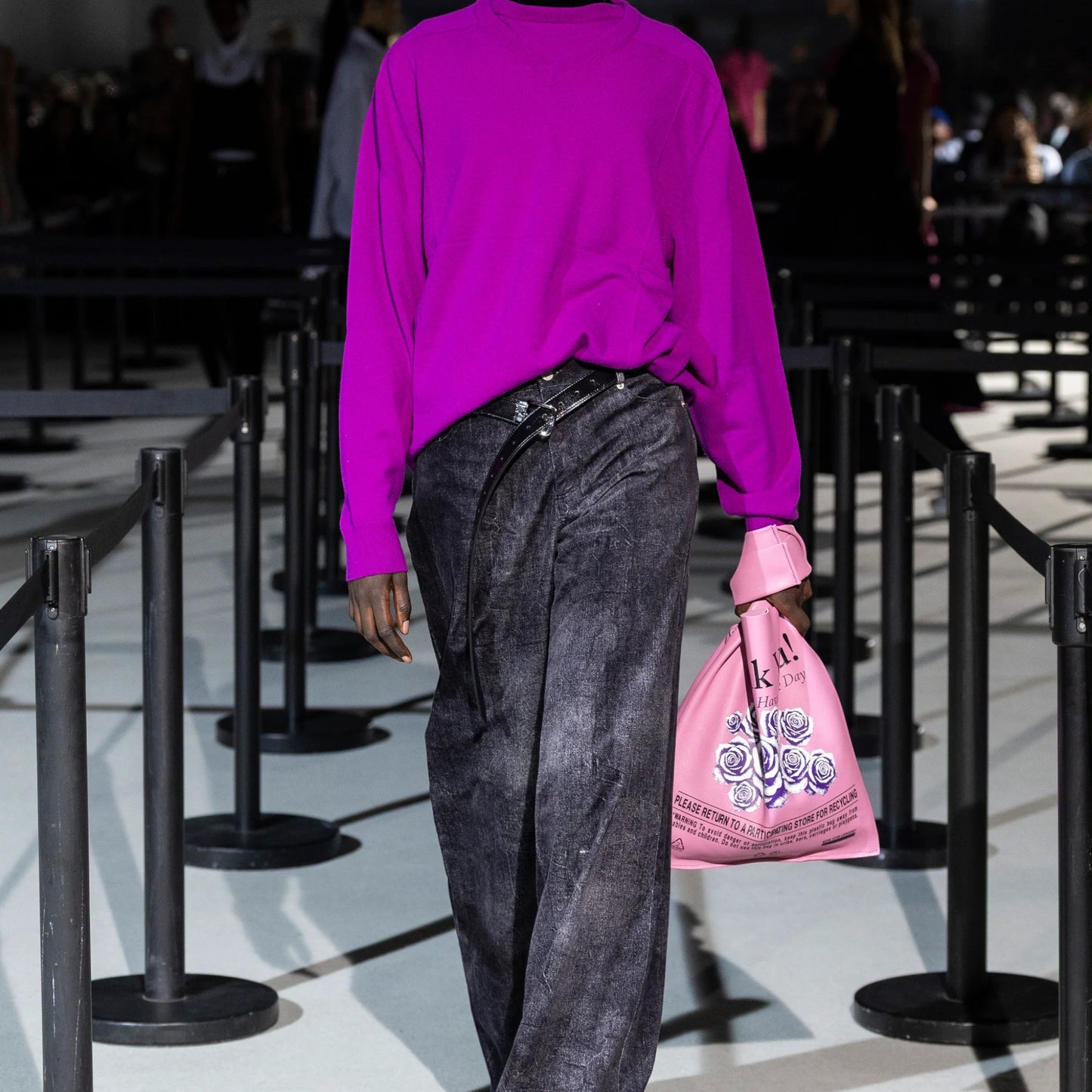 Tasoni Marie Adam-Leenaerdt violet merino wool dual neck knitwear with black turtleneck and wide-leg grey jeans.