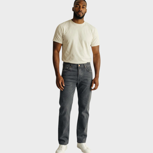 Model wearing Tasoni Massimo Alba Oceano classic denim pants in smoky grey with a white t-shirt and sneakers.