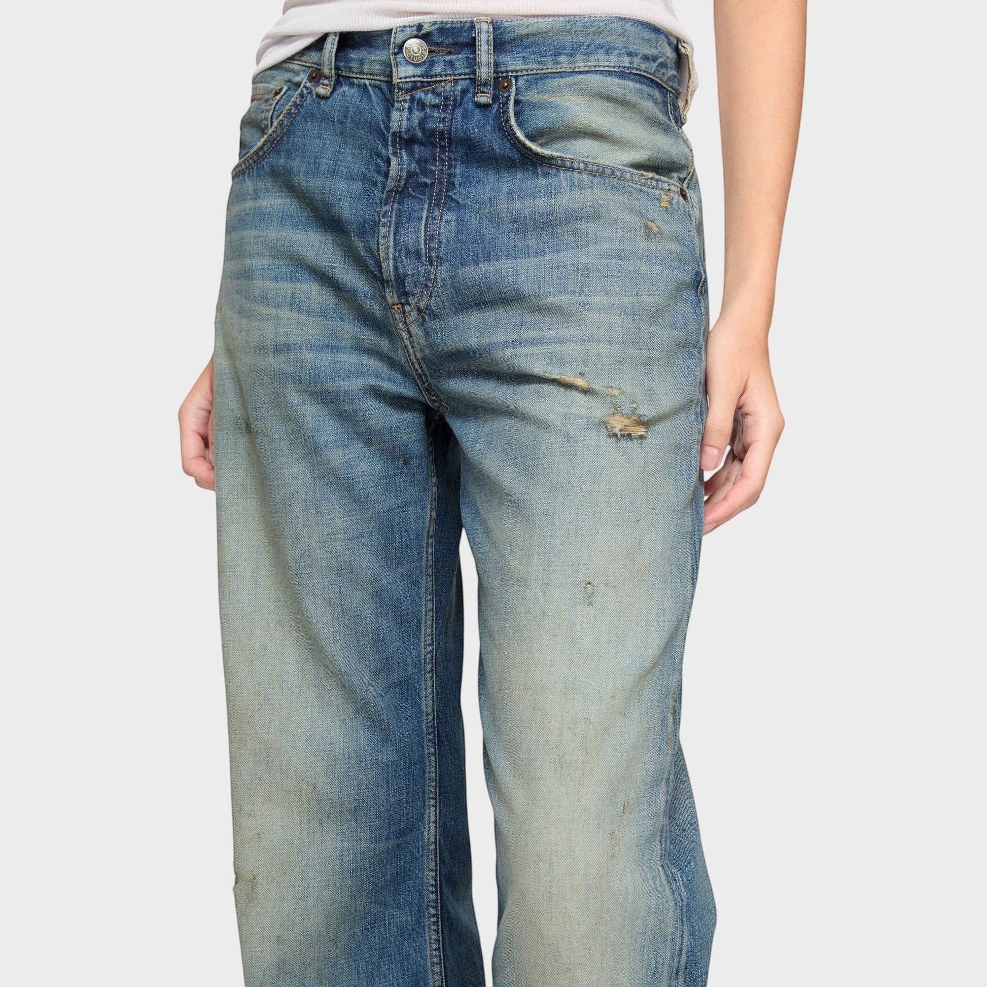 Tasoni mid blue cotton mid waist flare leg denim jeans with distressed details and faded wash.