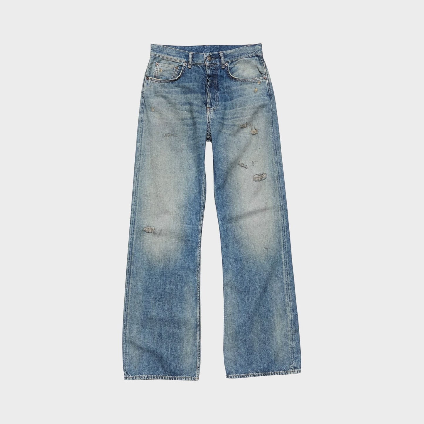 Tasoni mid blue cotton mid waist flare leg denim jeans with distressed details and a button fly.
