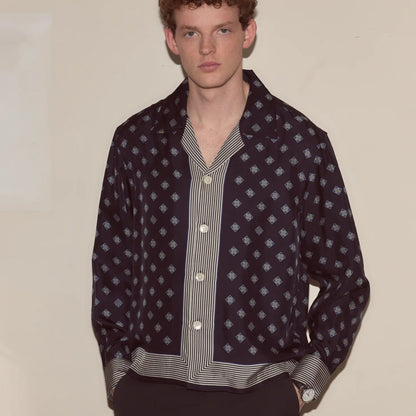 Tasoni navy blue long sleeve shirt with diamond pattern and striped placket. Model wears black pants.