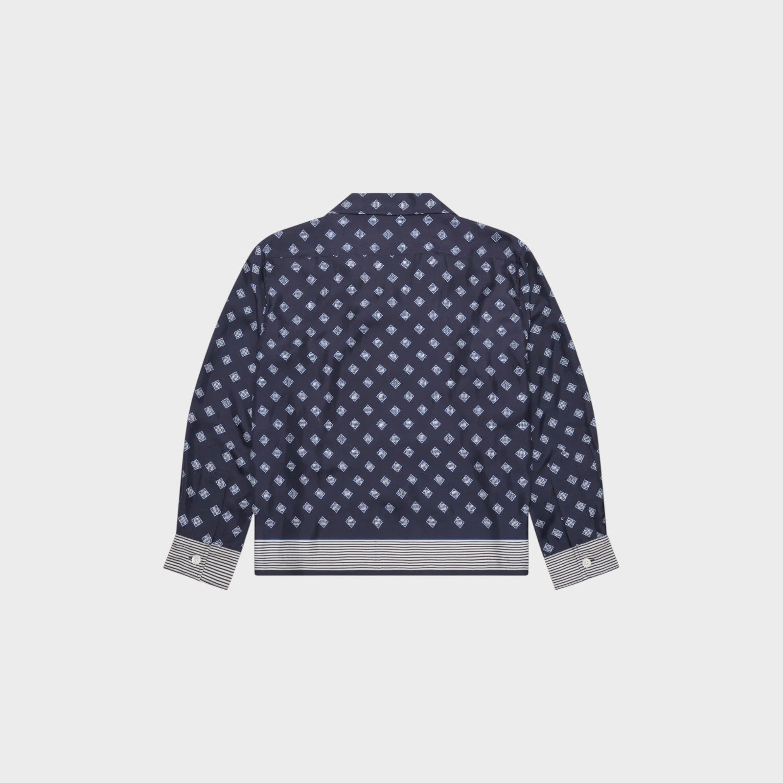 Tasoni navy blue long sleeve shirt with diamond pattern and striped hem and cuffs.