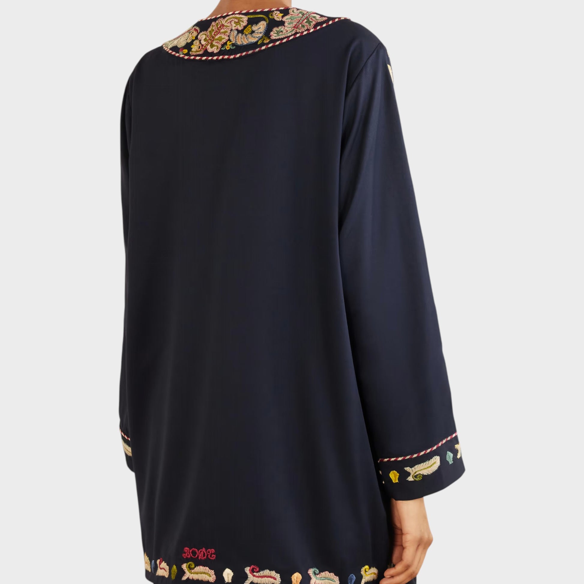 Tasoni navy blue long-sleeve jacket with embroidered neckline, cuffs, and hem featuring colorful feathers and the word BODE.
