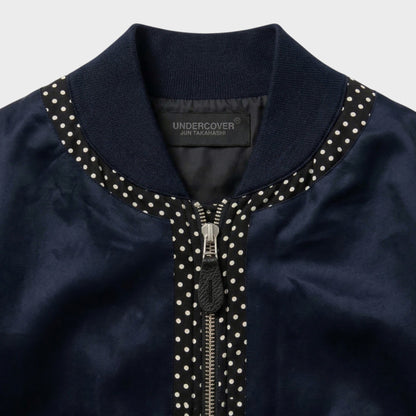 Tasoni navy satin bomber jacket with polka dot trim and zip closure.