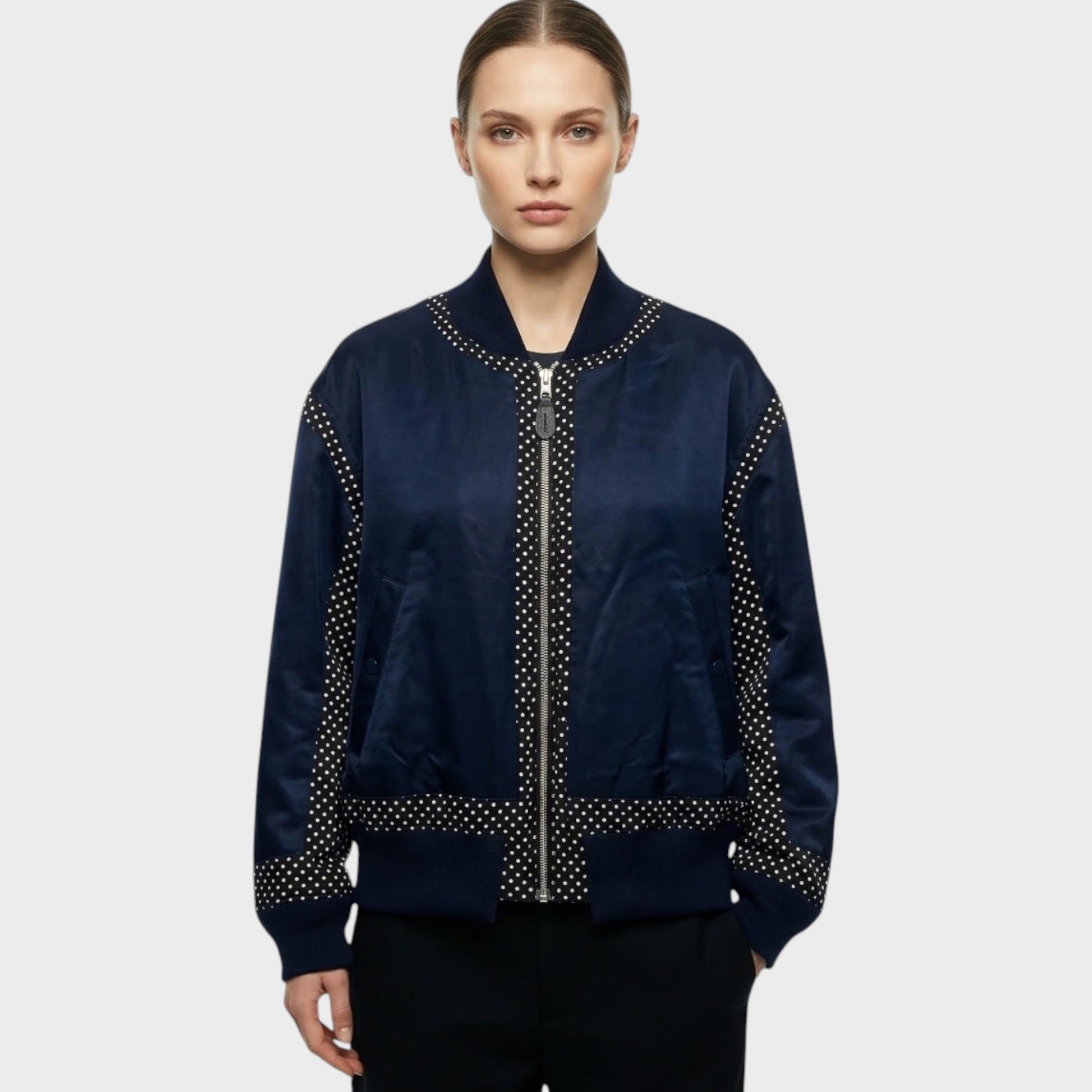 Tasoni navy satin zip-up bomber jacket with silver polka dot trim on collar, cuffs, hem, and down the front.