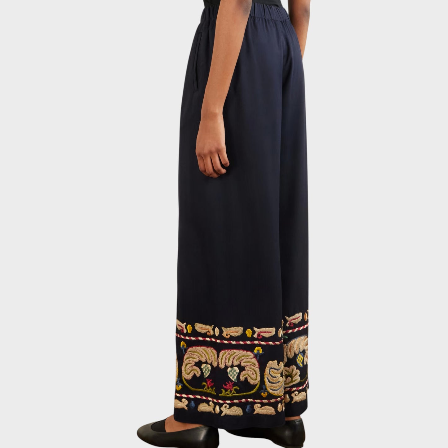Tasoni navy blue wide leg trousers with intricate feather embroidery on the hem.