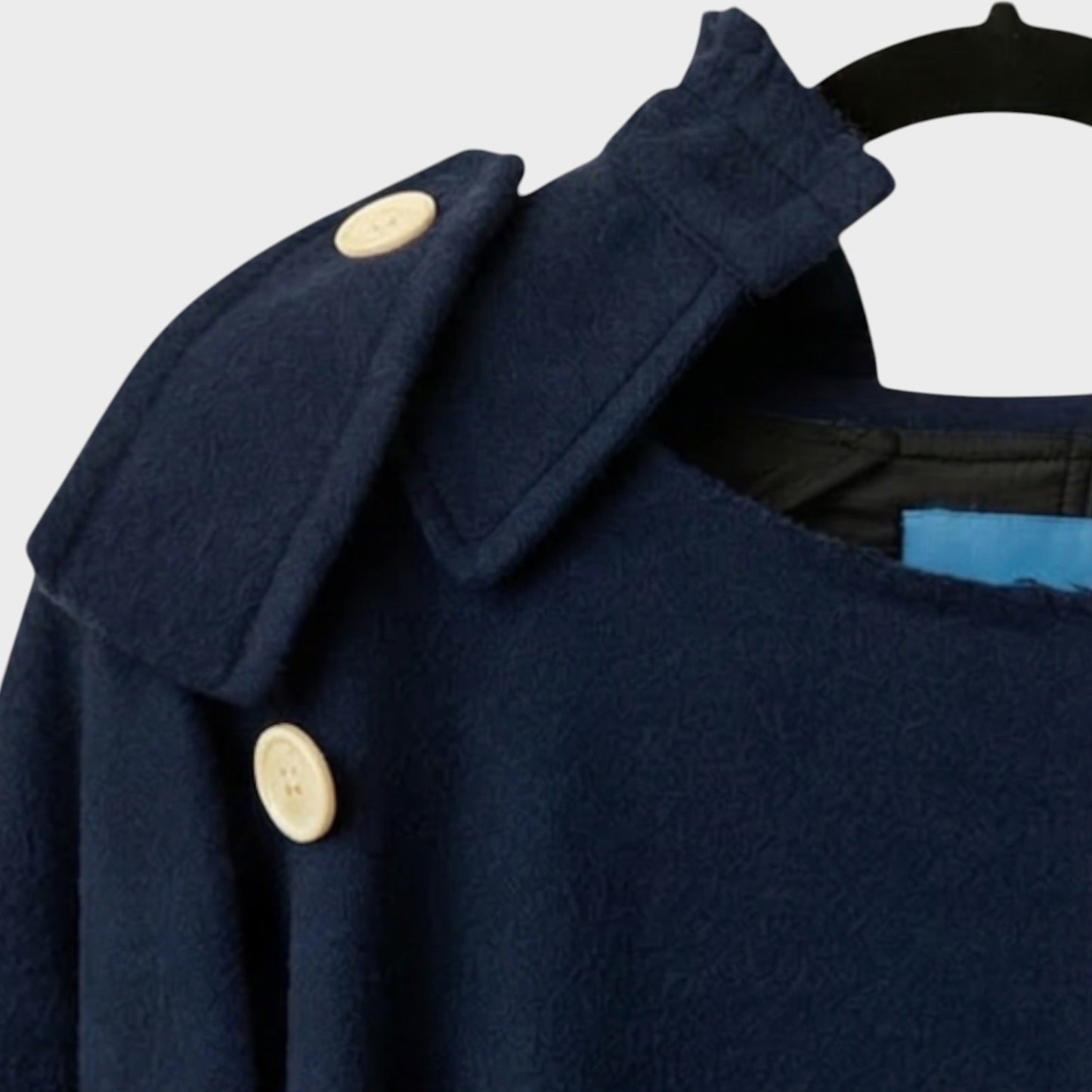 Tasoni navy blue wool coat with ruffled collar and cream button details.