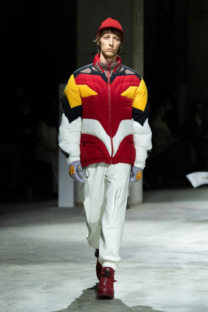 Tasoni Undercover Jacket: Red, yellow, white & black nylon puffer with high neck, zip-up front, and "Neon Genesis Evangelion" patches.
