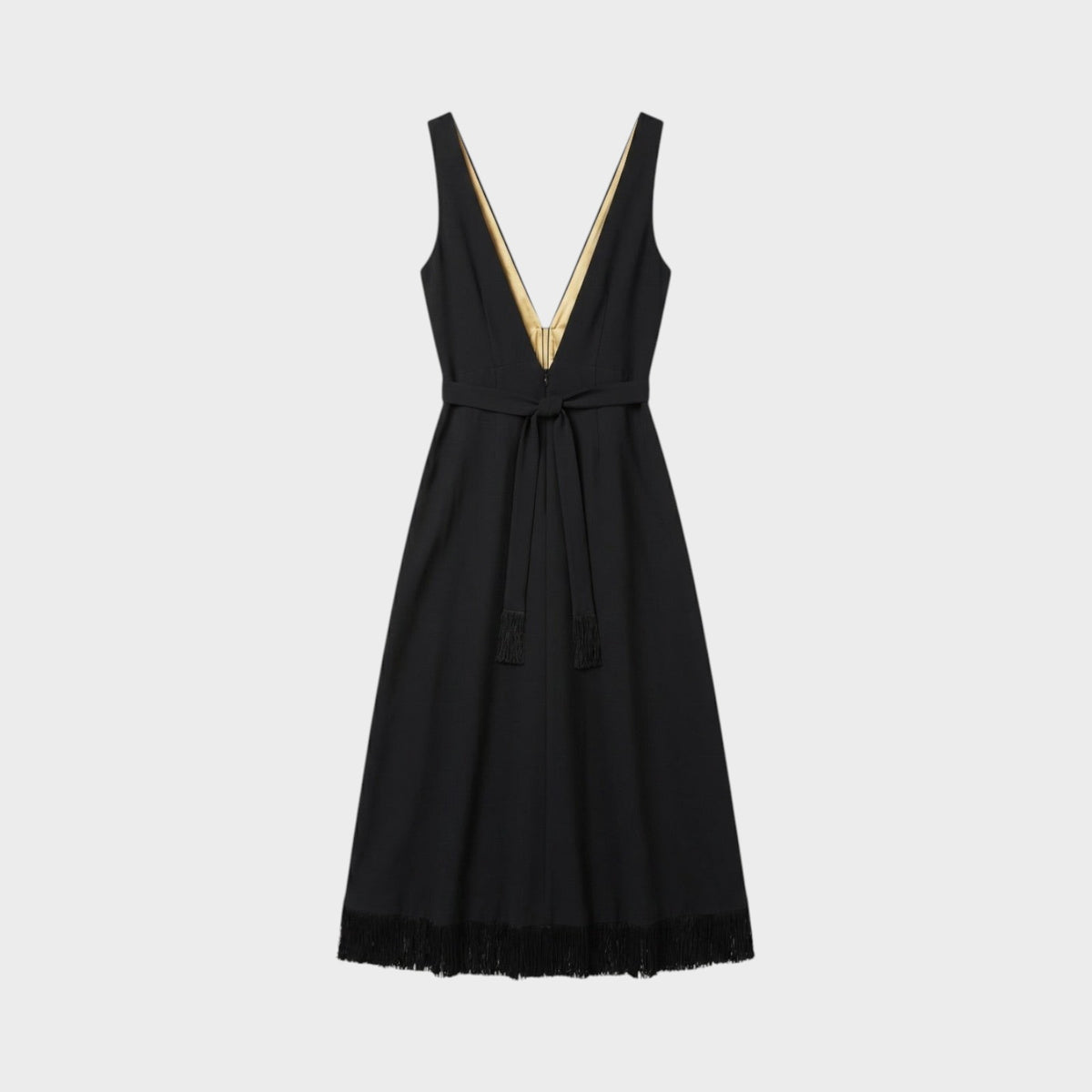 Tasoni Nina Ricci black sleeveless midi dress with a deep V-neck, gold lining, waist tie, and fringe hem detail.