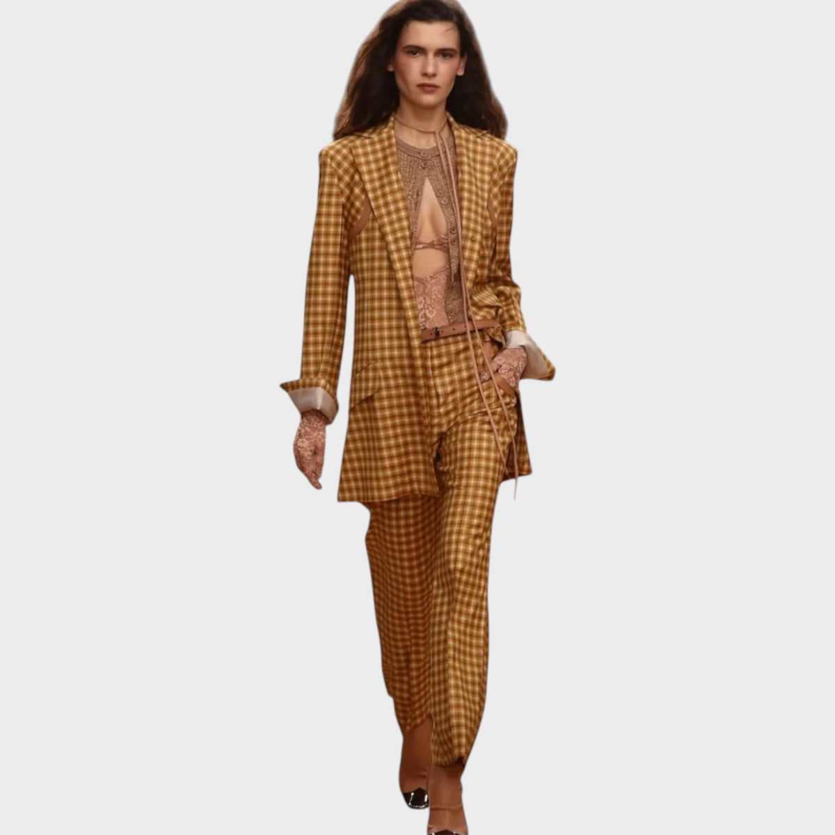 Model wearing a Tasoni Nina Ricci caramel gingham blazer and matching trousers on a runway