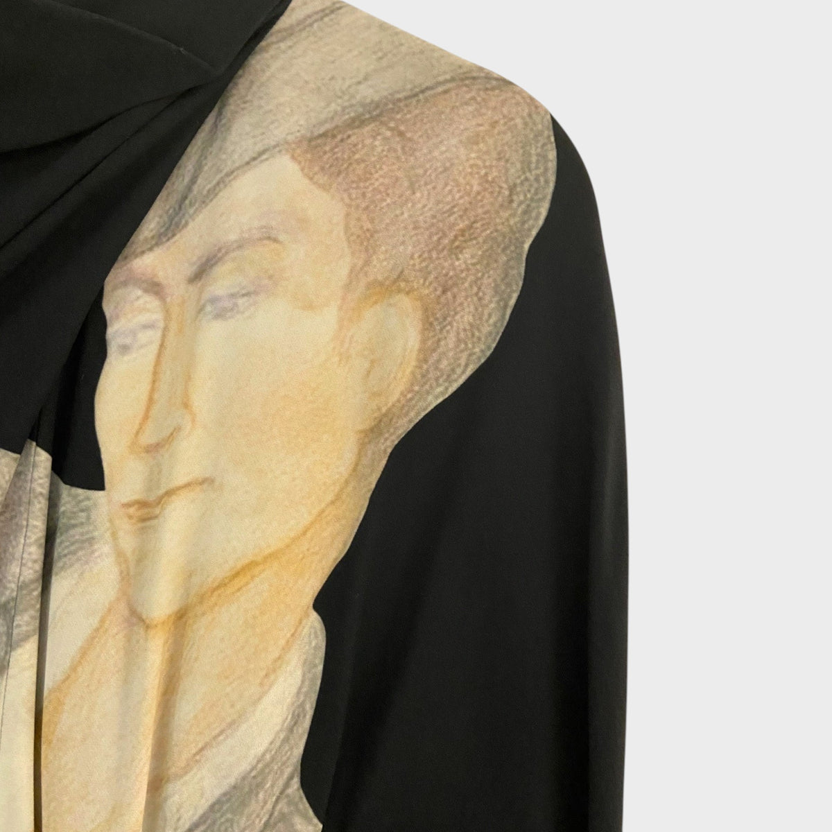 Tasoni Nina Ricci black draped dress featuring a detailed artistic portrait print on the shoulder