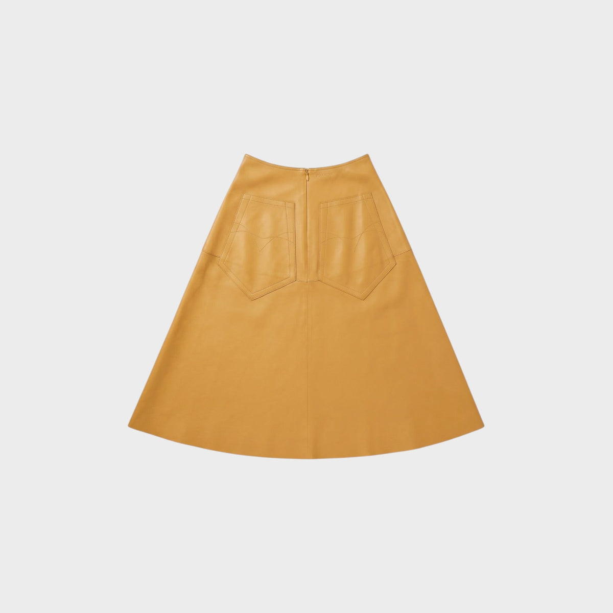 Tasoni Nina Ricci Miel A-line leather skirt in mustard yellow featuring back patch pockets and a zip closure.