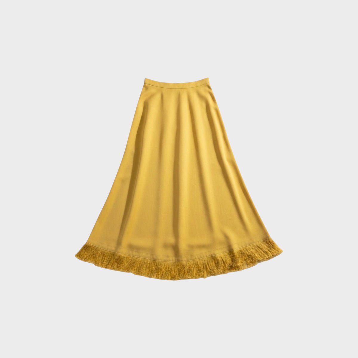 Tasoni Nina Ricci Miel skirt in mustard yellow featuring a flared silhouette and delicate fringe hem detail