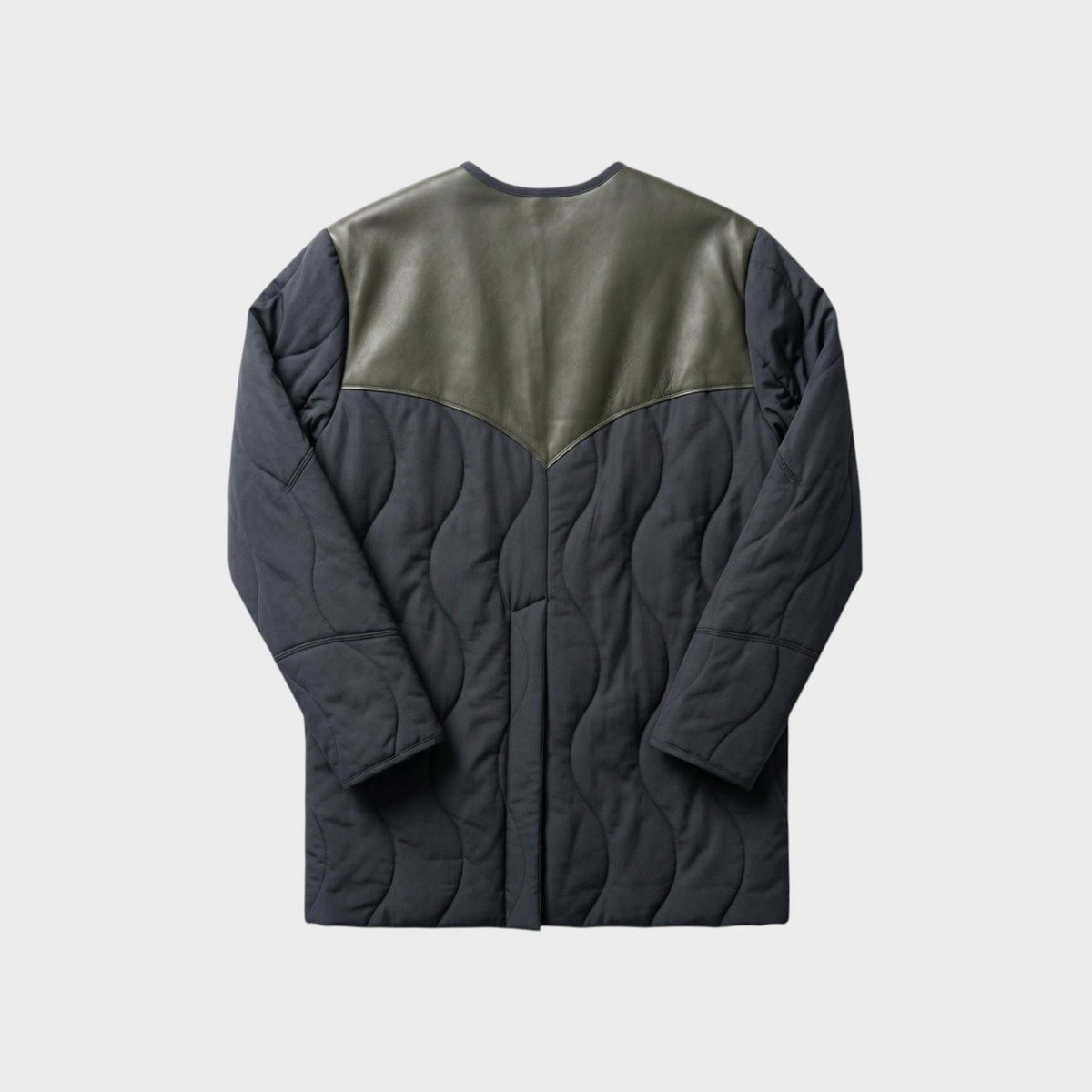 Tasoni Nina Ricci quilted coat in black with a contrasting olive green leather yoke back panel