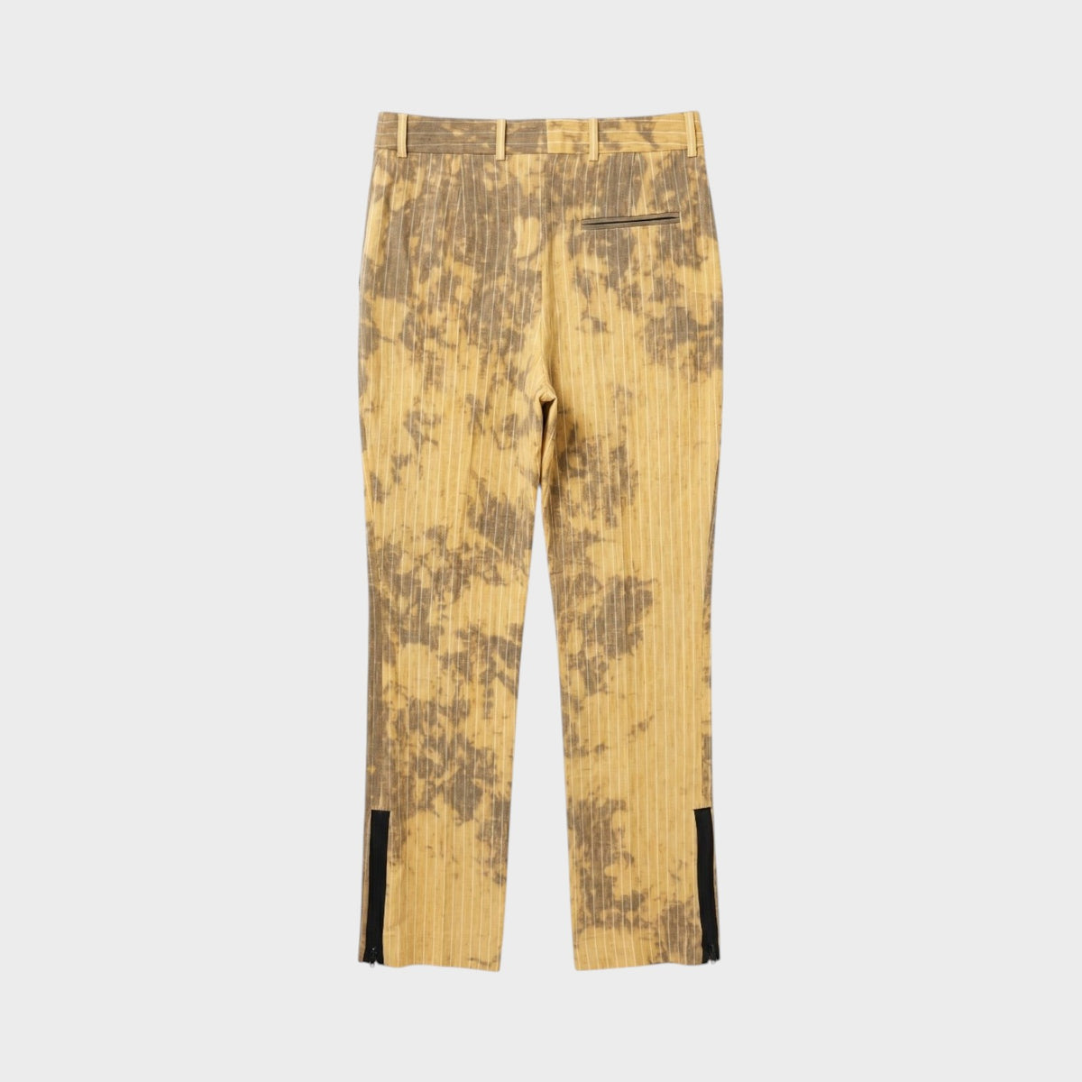 Tasoni Nina Ricci stone-colored linen trousers with vertical stripes, tie-dye pattern, and zippered ankle cuffs.