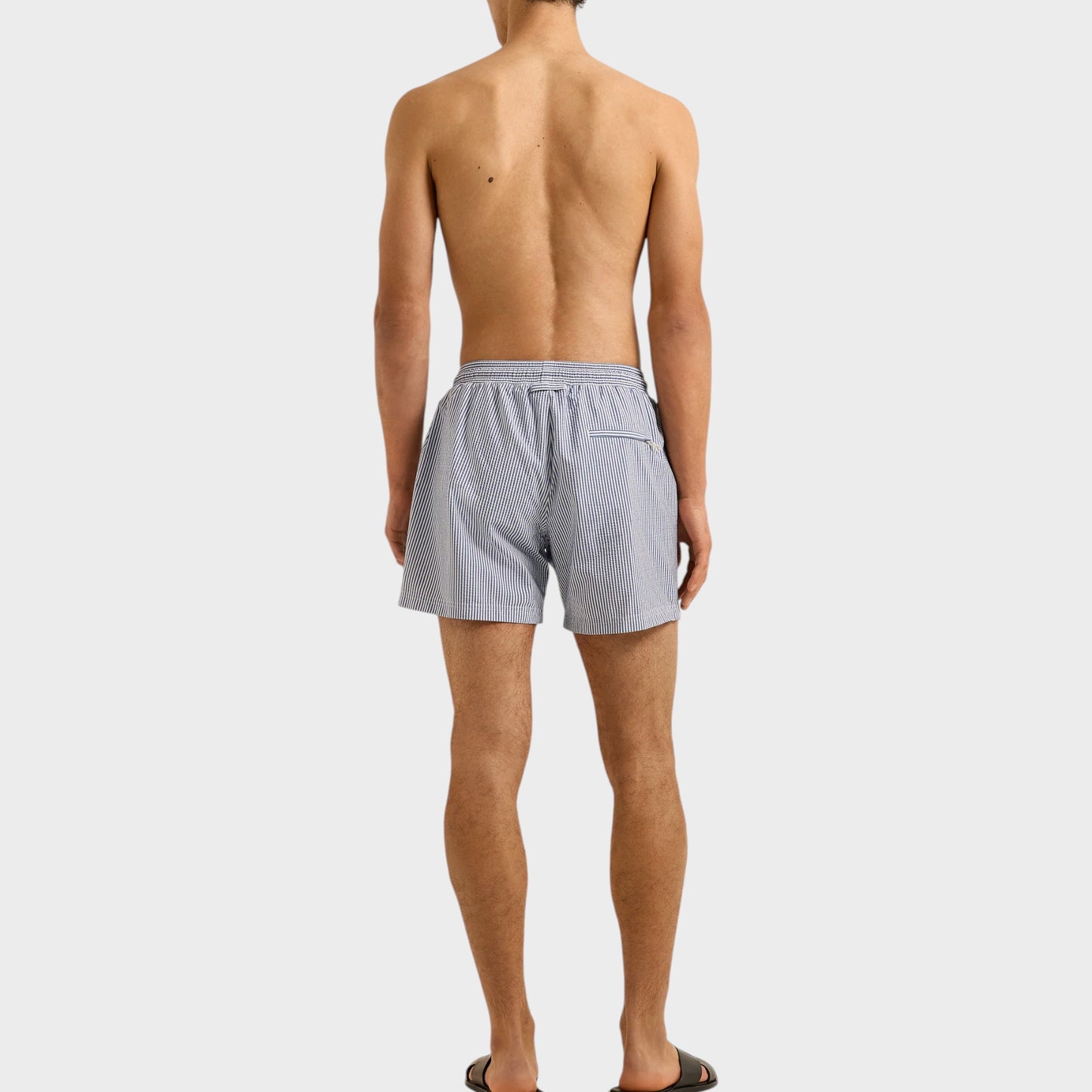 Tasoni Orlebar Brown Boxer III drawcord swim trunks in nova blue with seersucker stripe. Men's swimwear.