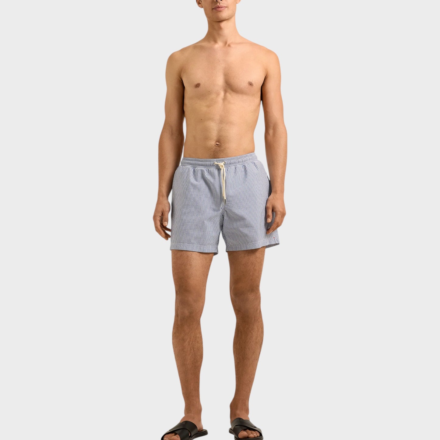 Tasoni Orlebar Brown Nova Blue seersucker stripe boxer swim trunks with drawstring waist.