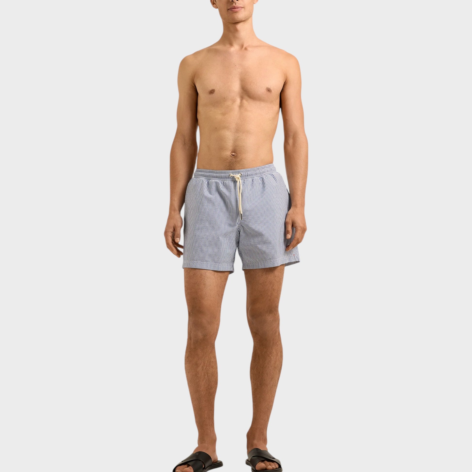 Tasoni Orlebar Brown Nova Blue seersucker stripe boxer swim trunks with drawstring waist.