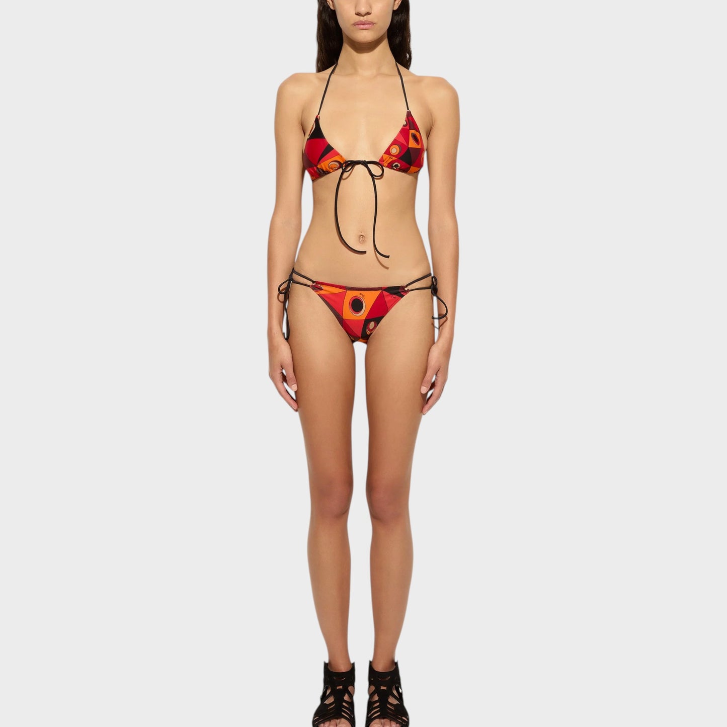Tasoni Pucci Swimwear orange and black bikini bottom with Occhi print, featuring a tie-side design and adjustable straps.
