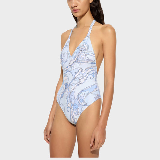 Tasoni pale blue one piece swimsuit with V-neck and halter straps, featuring a white and blue orchidee print.