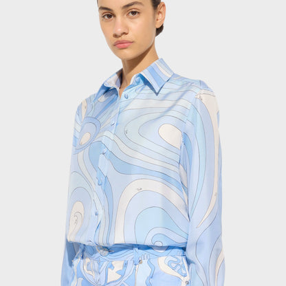 Tasoni pale blue silk classic shirt with Marmo print and button-up front. Model is wearing matching trousers.