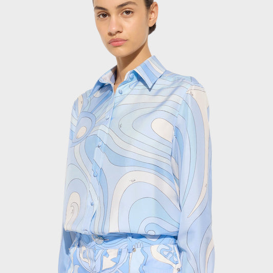 Tasoni pale blue silk classic shirt with Marmo print and button-up front. Model is wearing matching trousers.