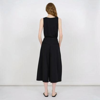 Tasoni Partow Ida black virgin wool wide-leg trousers worn by a model from the back view.
