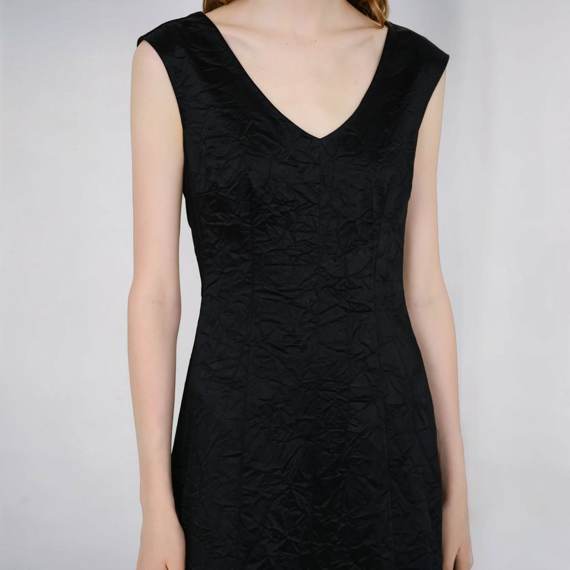 Tasoni Partow Koda black sleeveless cotton blend dress with a textured, crinkled fabric and a flattering V-neckline.