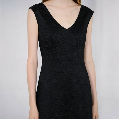 Tasoni Partow Koda black sleeveless cotton blend dress with a textured, crinkled fabric and a flattering V-neckline.