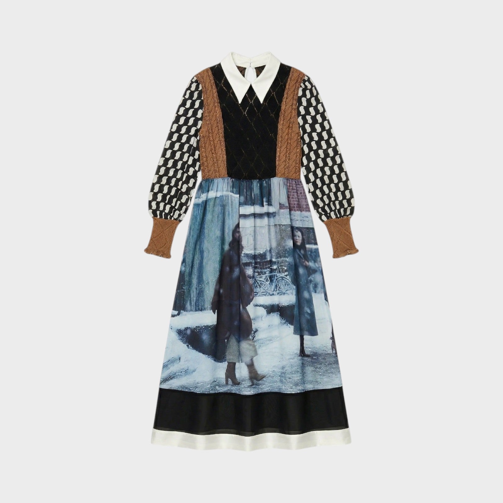 Tasoni long sleeve midi dress with a pointed collar, featuring a patchwork design with brown and black knit sleeves and a print of figures in a snowy urban scene.