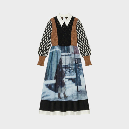 Tasoni long sleeve midi dress with a pointed collar, featuring a patchwork design with brown and black knit sleeves and a print of figures in a snowy urban scene.